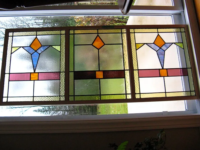 A central panel was added to this pair of old windows